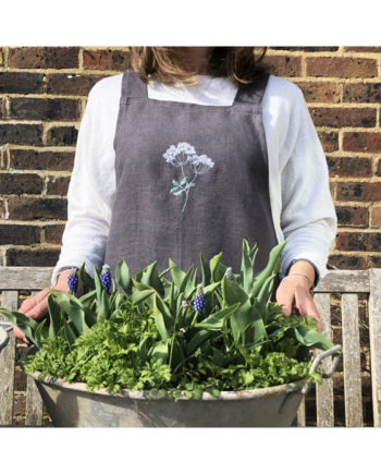 grey linen apron embroidered by Sarah Becvar
