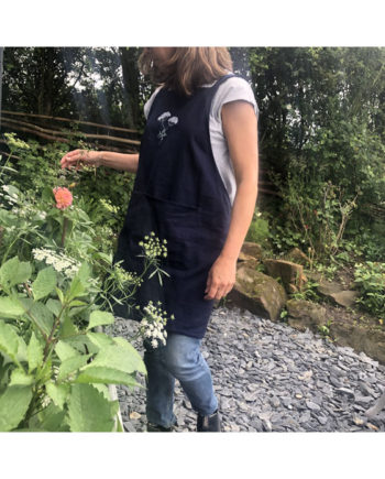 midnight blue linen apron with embroidered cow parsley detail by Sarah Becvar embroidery freehand machine embroidery textile pinafore apron