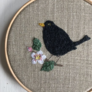blackbird embroidered hoop embroidery Sarah Becvar hoop blossom flower