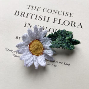 freehand machine embroidered daisy brooch embroidered by textile artist Sarah beaver a unique product made entirely out of embroidery