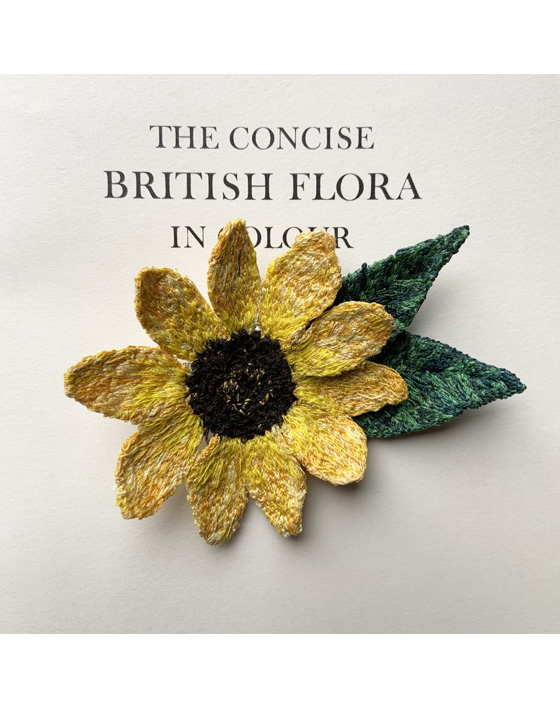 sunflower brooch made entirely from freehand machine embroidery and stitched by Sarah Becvar