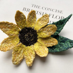 sunflower brooch made entirely from freehand machine embroidery and stitched by Sarah Becvar