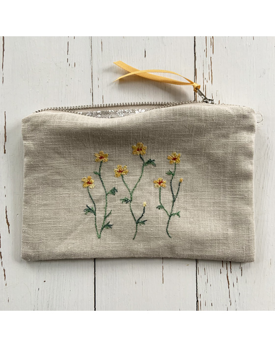 freehand machine embroidered linen pouch embroidered with wild flowers and stitched by textile artist sarah becvar