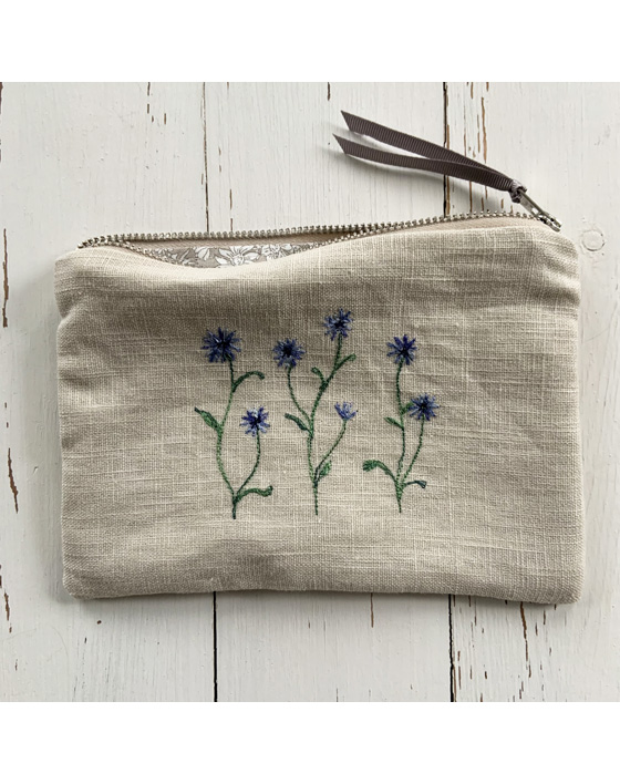 freehand machine embroidered linen pouch embroidered with wild flowers and stitched by textile artist sarah becvar