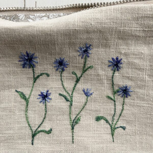 freehand machine embroidered linen pouch embroidered with wild flowers and stitched by textile artist sarah becvar