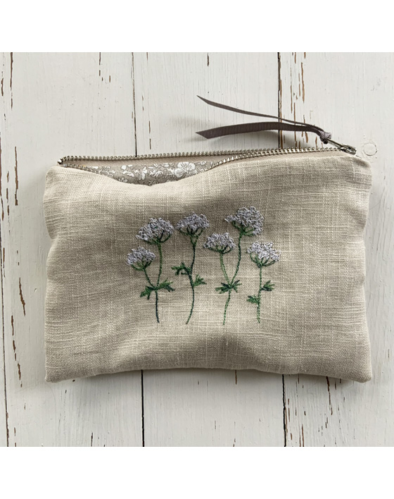 freehand machine embroidered linen pouch embroidered with wild flowers and stitched by textile artist sarah becvar