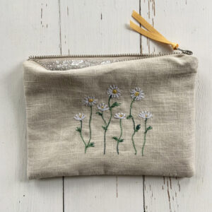 freehand machine embroidered linen pouch embroidered with wild flowers and stitched by textile artist sarah becvar