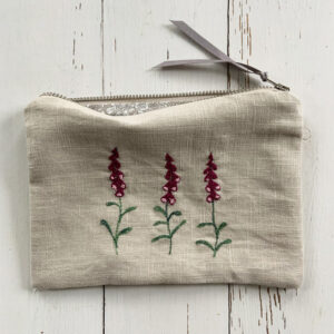 freehand machine embroidered linen pouch embroidered with wild flowers and stitched by textile artist sarah becvar