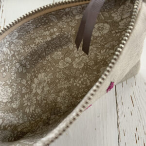 freehand machine embroidered linen pouch embroidered with wild flowers and stitched by textile artist sarah becvar