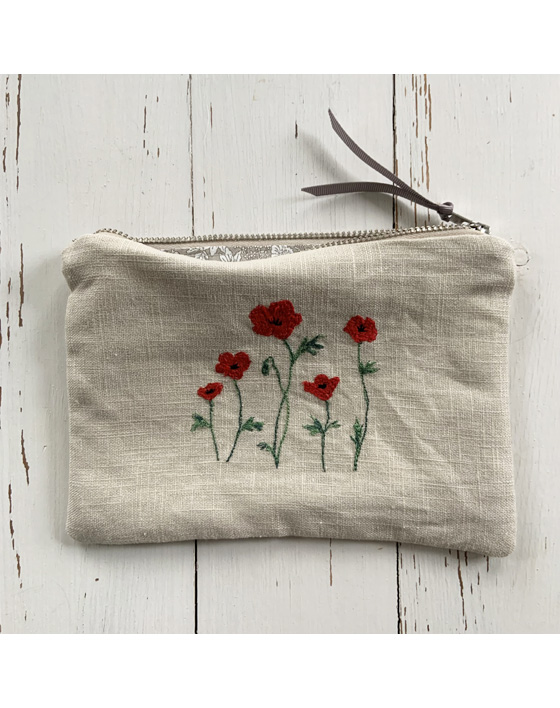 freehand machine embroidered linen pouch embroidered with wild flowers and stitched by textile artist sarah becvar