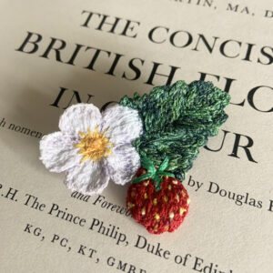 a unique freehand machine embroidered flower brooch product made entirely out of embroidery