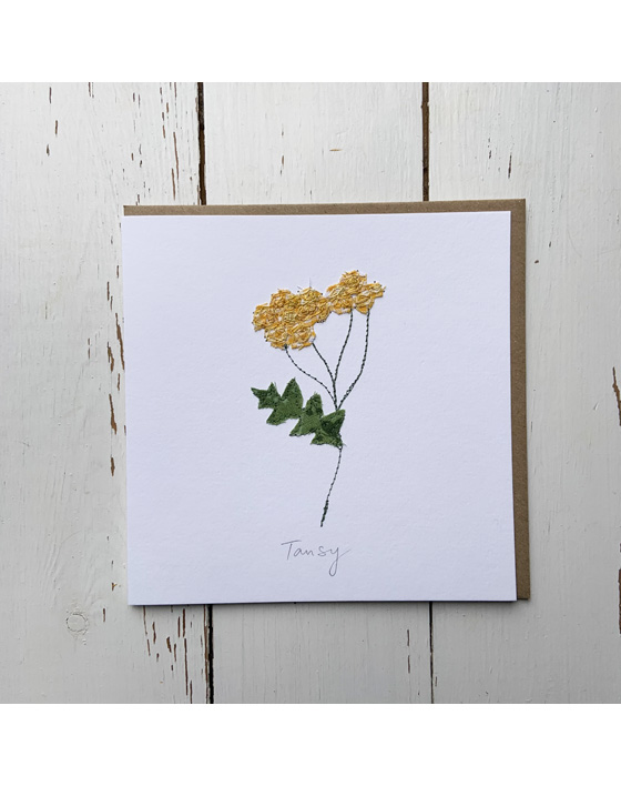 a wildflower notecard stitched directly onto a card blank using free motion machine embroidery and appliqué stitched by textile artist Sarah Becvar