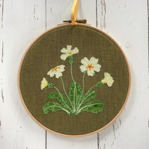 freehand machine embroidered flower hoop with applique embroidery by sarah becvar
