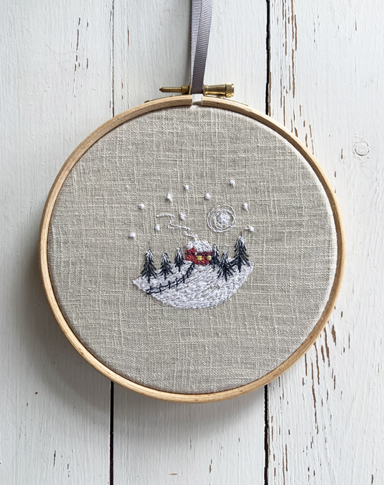 freehand machine embroidered winter snow scene embroidered by textile artist sarah becvar