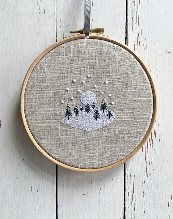 freehand machine embroidered winter snow scene embroidered by textile artist sarah becvar