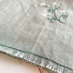 freehand machine embroidered linen napkin with herbs embroidered by sarah becvar