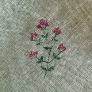 freehand machine embroidered linen napkin with herbs embroidered by sarah becvar